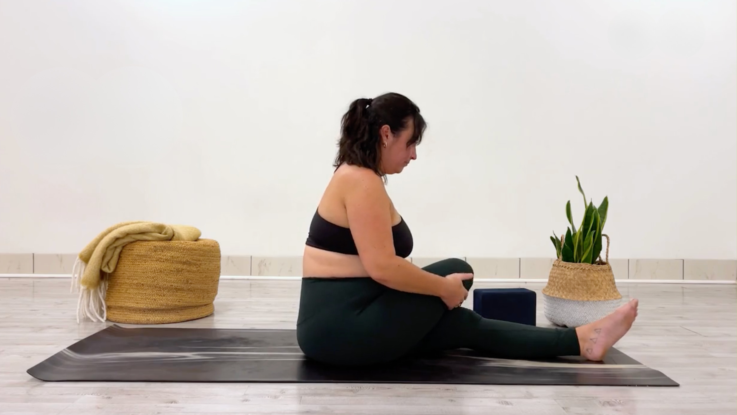 Yoga teacher Taylor Lorenz in Half Shoelace, part of her series of glute stretches
